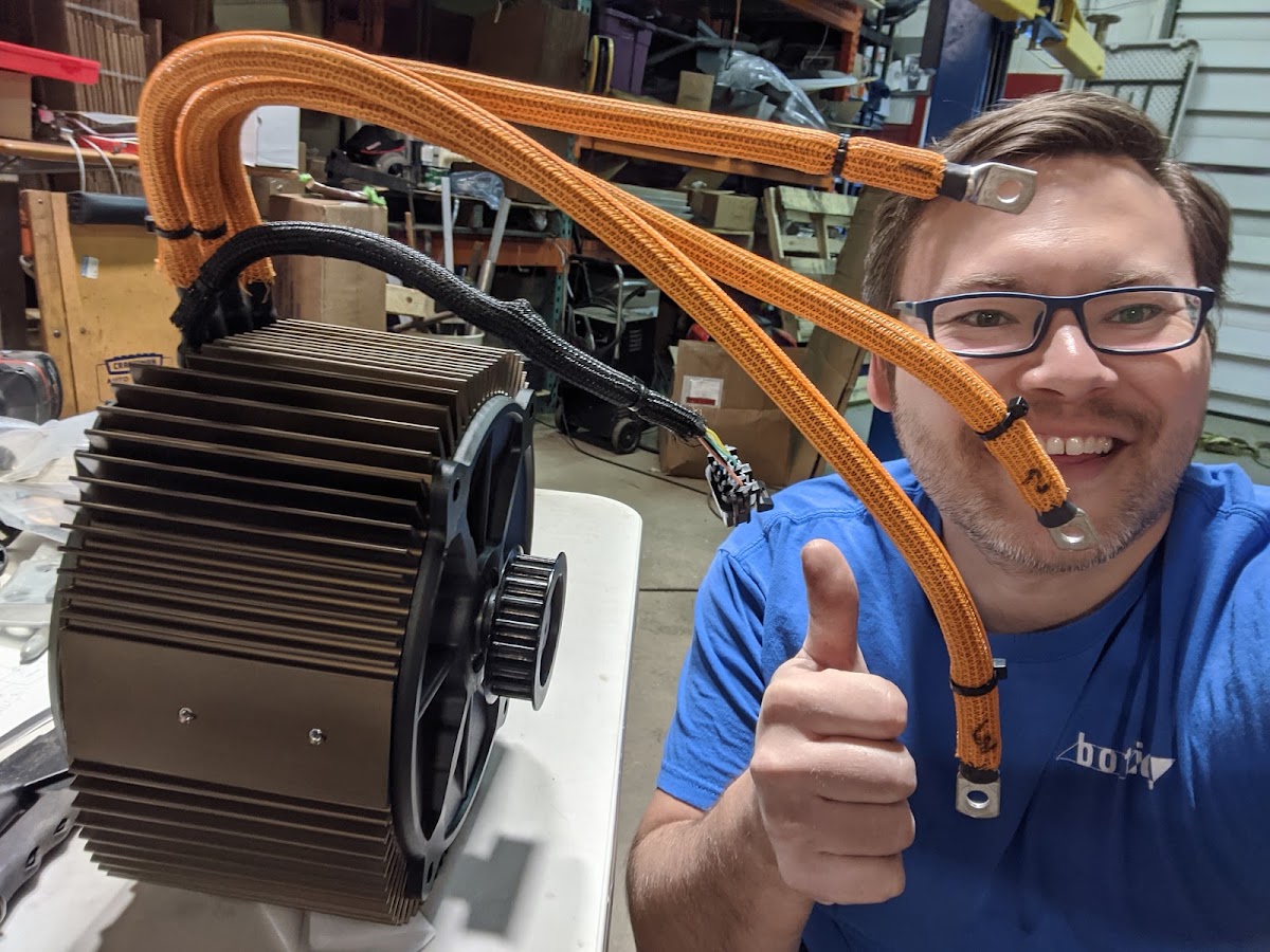 Jim holding the 67 hp ZF75 electric motor from a Zero SR motorcycle